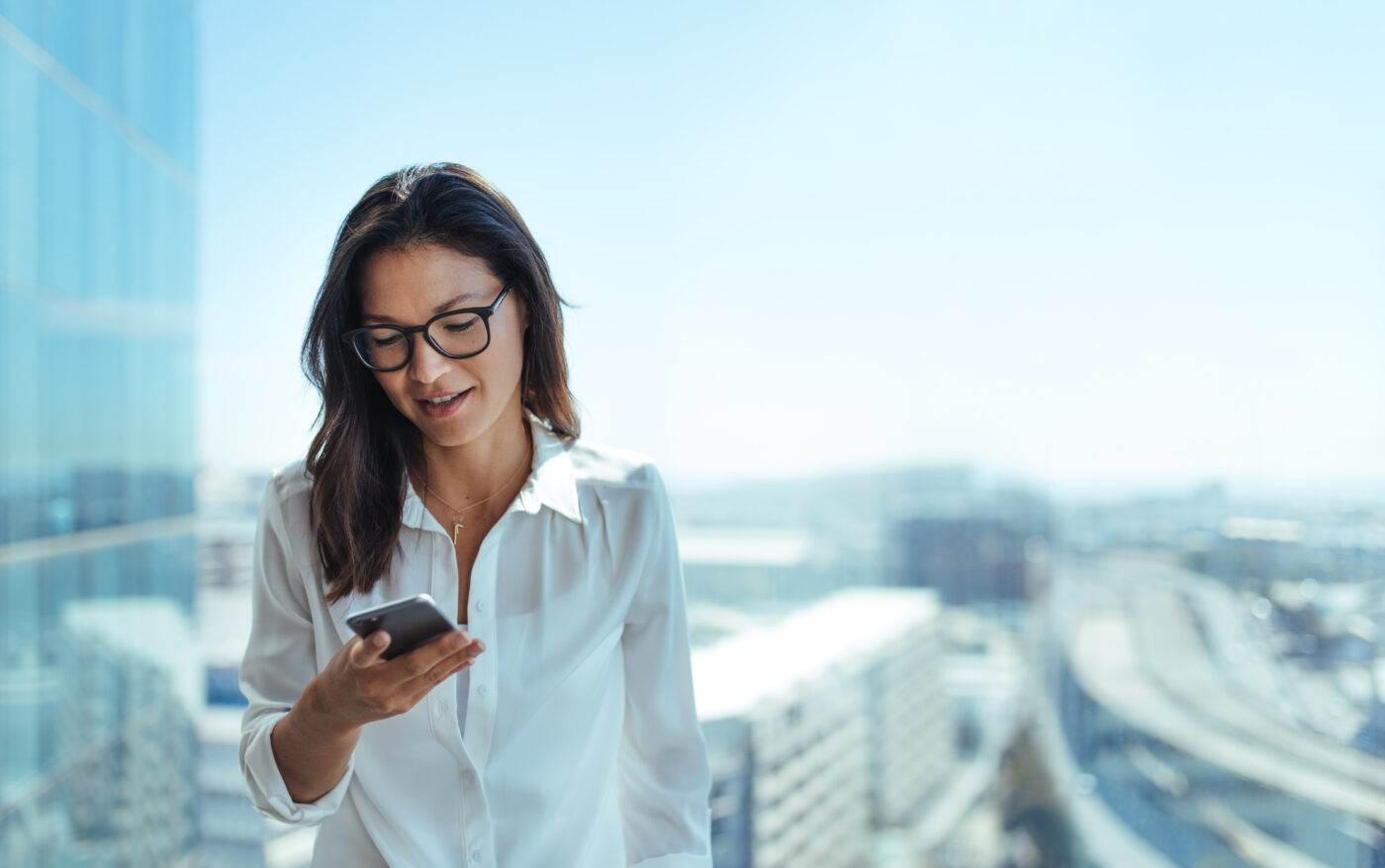 Modern young Businesswoman,Sending,Text,Messages,Using,Mobile,Phone.,Young,Woman,Standing